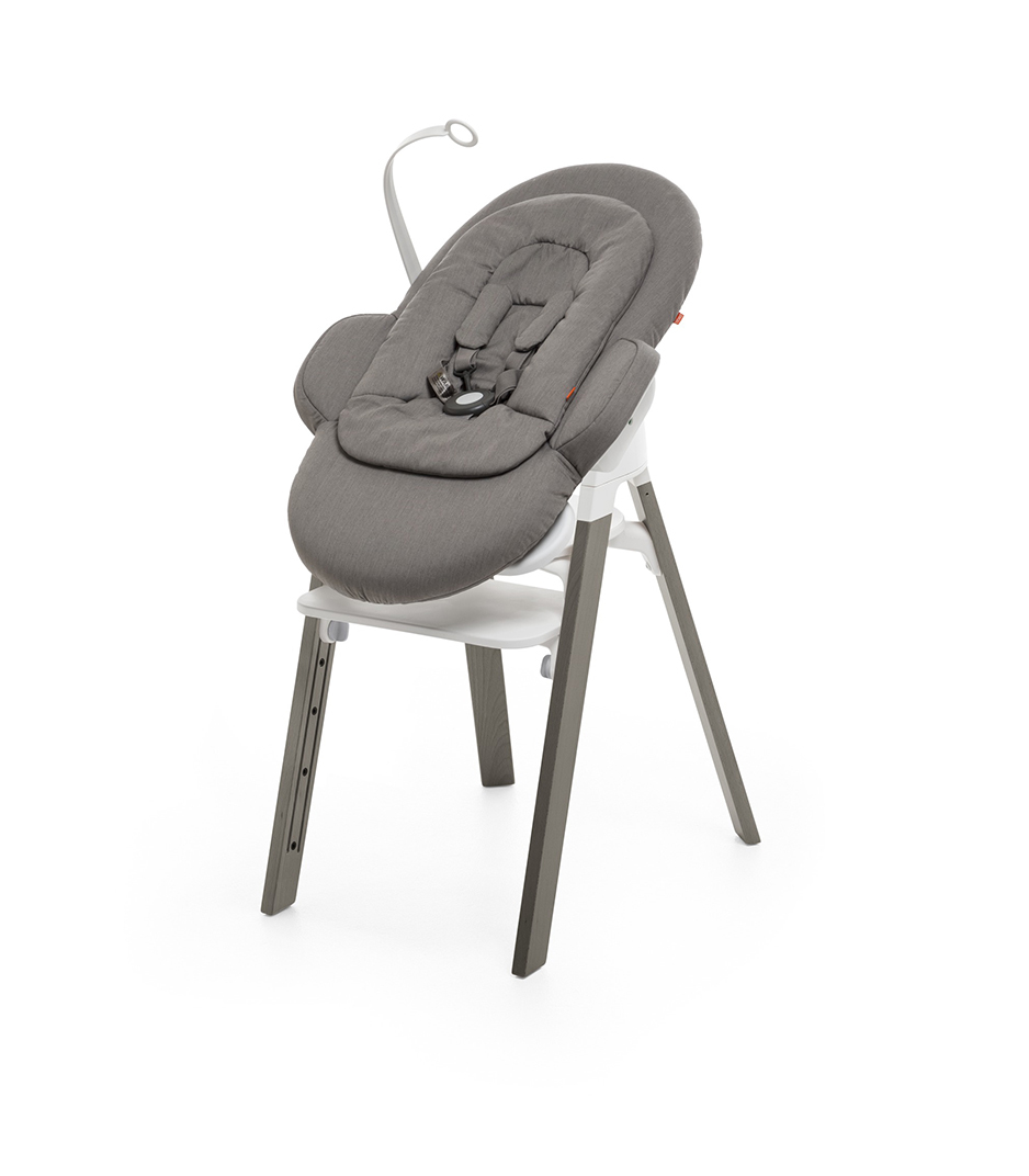 Bouncer, Greige. Mounted on Stokke Steps highchair.